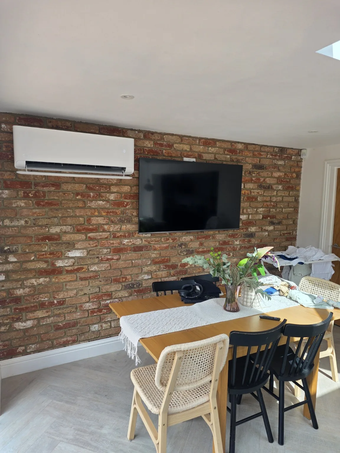 Air conditioning installed on brick feature wall